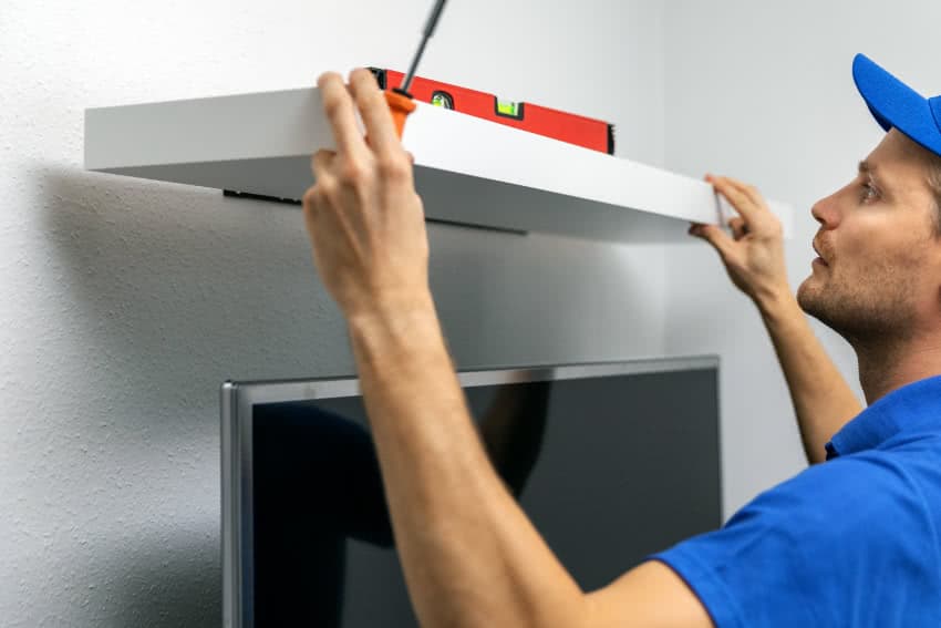 installing a shelf above the TV for a soundbar